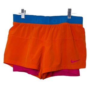 🏃‍♀️- Nike Dri-fit orange shorts with pink and just do it around the waist ban…